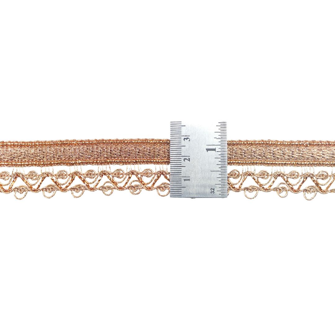 Decorative lace trim with a ruler for measurement on a white background